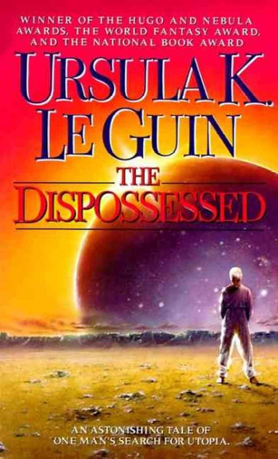 Book cover for "The Dispossessed" by Ursula K. Le Guin. The image shows a lone figure (right) standing on a barren stretch of land, looking towards a rising or setting planet in the background, which has a glint of light peeking around its edge, presumably the sun behind it. At the top, text reads, "Winner of the Hugo and Nebula Awards, The World Fantasy Award, and the National Book Award." At the bottom of the cover white text reads, "An astonishing tale of one man's search for utopia."