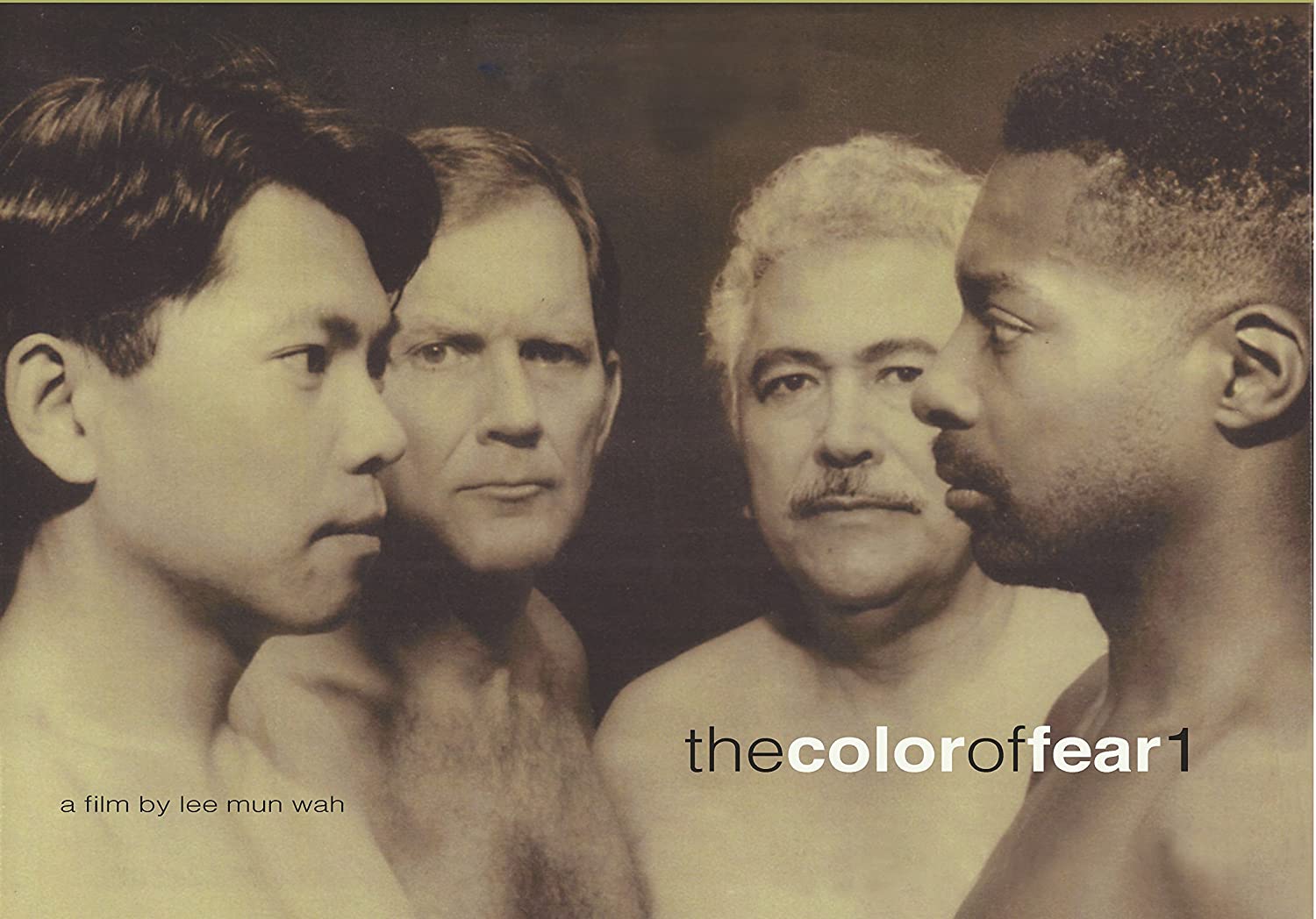 The cover, in black and white, for the film. Four shirtless men are standing closely together. In the foregrounded left is an Asian man facing the Black man on the right, who is looking straight back. Behind them, both looking at the viewer, are a white man (left) and a Latino man (right). Bottom left text: a film by Lee Mun Wah. Bottom right text: The Color of Fear 1.